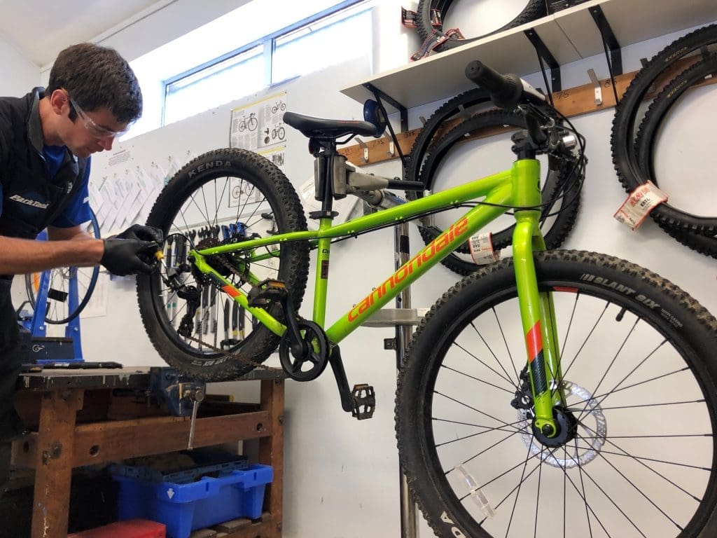 Adventure Aberdeen mechanic working in the bike workshop